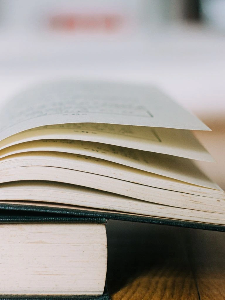 The 2024 Comment Moderation Benchmark Report laid open on a desk